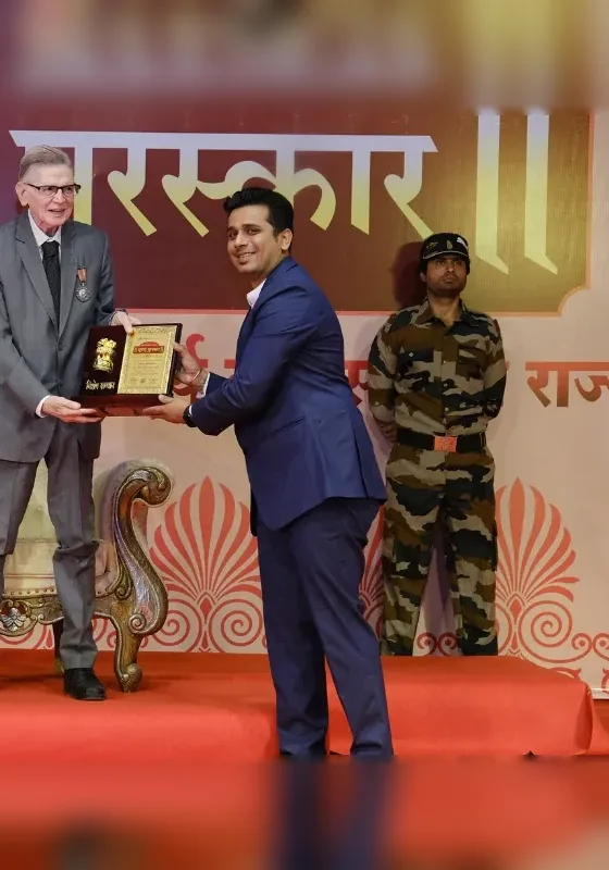 Dr. Shinde receiving the Bhushan Puraskar national award for Ayurvedic cancer care